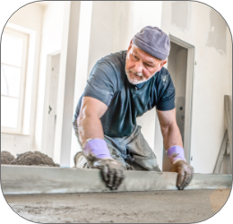 Filling the floor of a renovated apartment with concrete, screed and leveling the floor by construction workers. Even floors made of a mixture of ceme